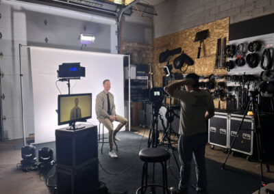 A man sitting in front of a camera.